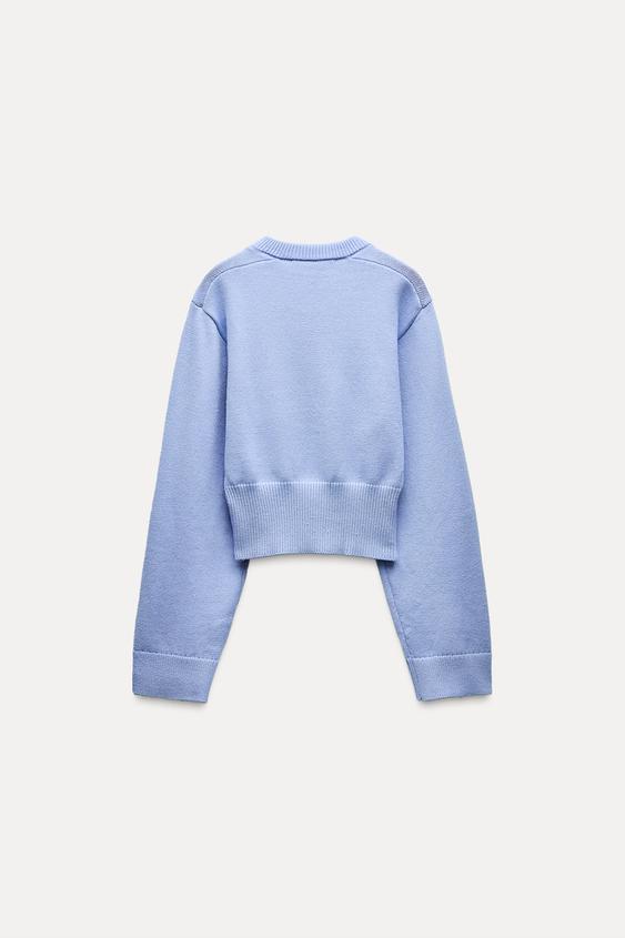Pull court en tricot à manches larges