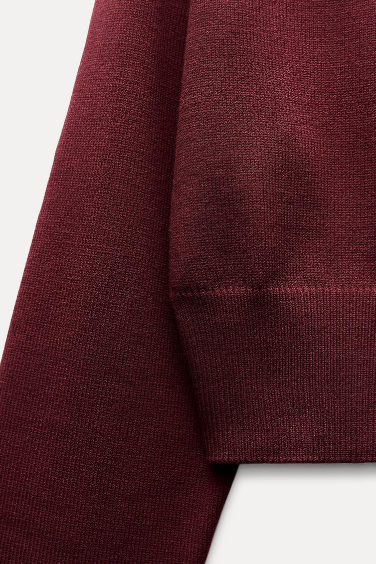 Pull court en tricot à manches larges